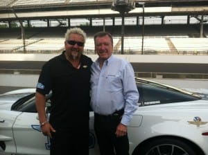 Guy Fieri as he finishes his practice run with 3 time Indy 500 champ, Johnny Rutherford