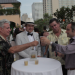 King Cocktail Dale DeGroff, BourbonBlog.com’s Tom Fischer and Pisco Porton’s Master Distiler John Schuler and CEO Jean-Francois Bonneté at Tales of the Cocktail toasting atop Hotel Monteleone Poolside