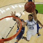 UK forward Anthony Davis (23) goes to the hoop against Kansas center Jeff Withey (left) during the second half of the national championship game 2012