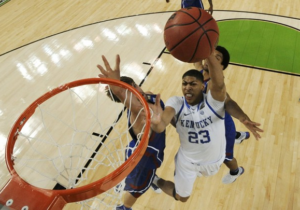 Kentucky forward Anthony Davis (23) goes to the hoop against Kansas center Jeff Withey (left) during the second half of the national championship game.