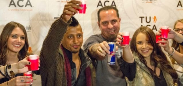 DJ Ravindrums and Corey Miller toast with TUACA at Drinks & Ink in Denver,Colorado