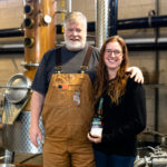 Todd Leopold and Nicole Austin Holding Bottle
